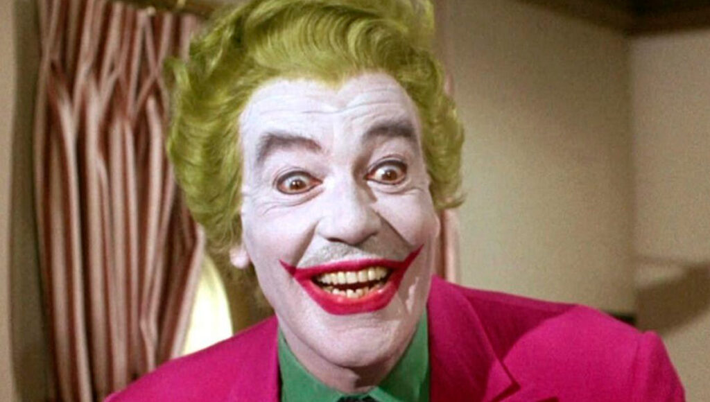 Cesar Romero como o personagem Coringa